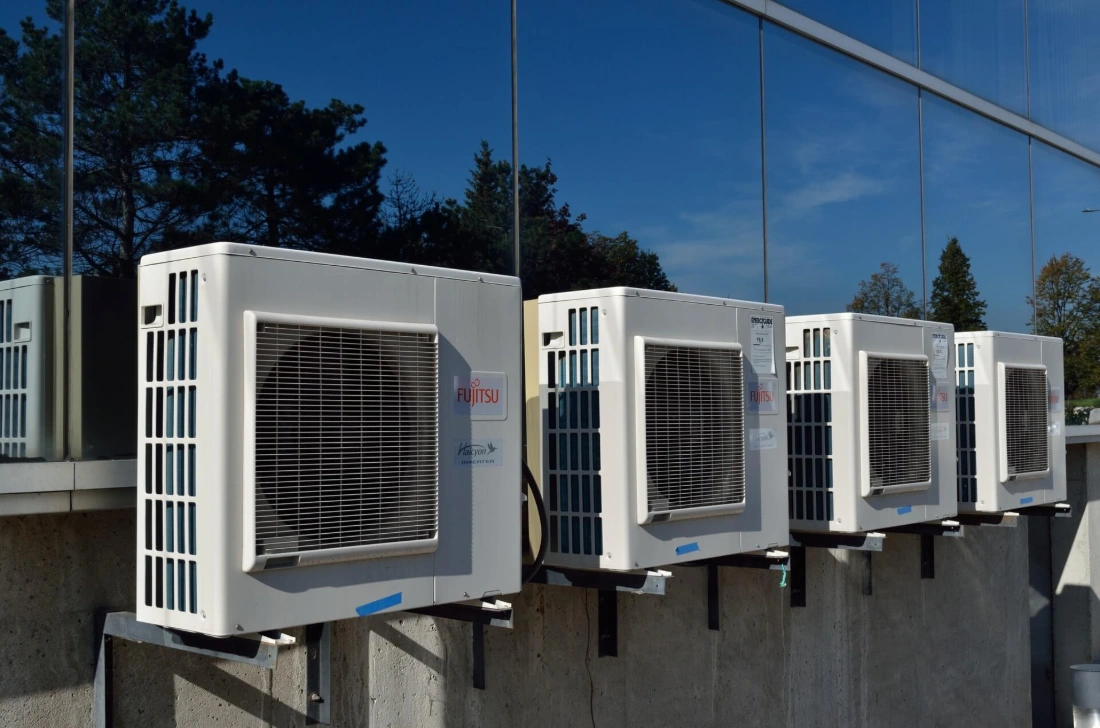 HVAC technician servicing an air conditioning unit